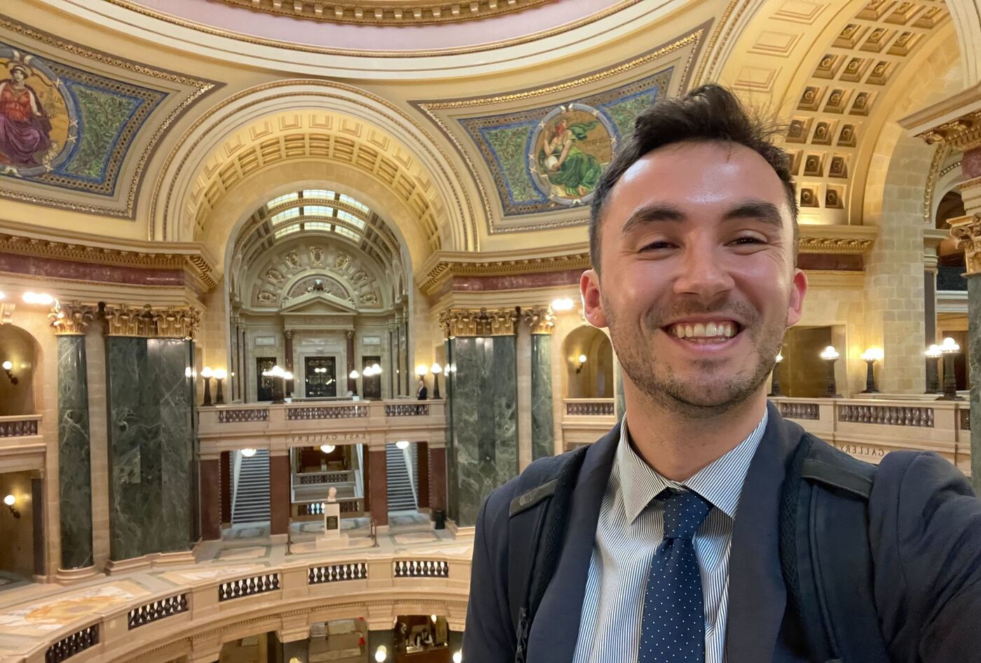 Free Press Action’s Alex Frandsen at the Wisconsin statehouse to celebrate the introduction of legislation designed to strengthen local journalism.