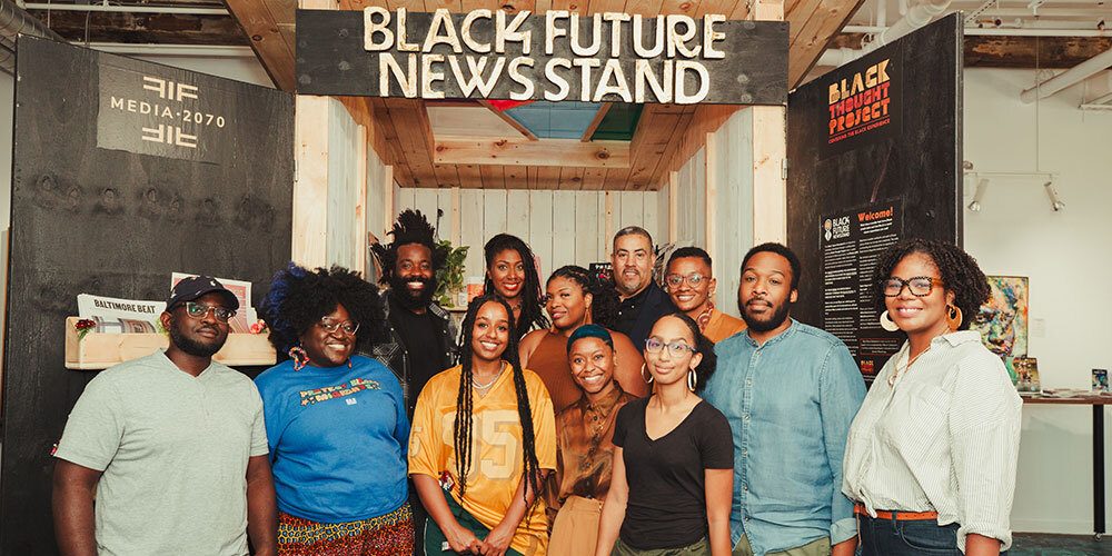 Media 2070 staff and allies gathered in front of the Black Future Newsstand installation in Chicago